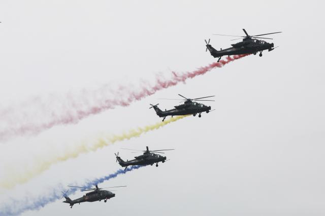 (251016) -- TIANJIN, Oct. 16, 2025 (Xinhua) -- Helicopters of Fenglei aerobatic team of the Chinese People's Liberation Army (PLA) perform during the opening ceremony of the 7th China Helicopter Exposition in north China's Tianjin Municipality, Oct. 16, 2025. Spanning an exhibition area of approximately 160,000 square meters, the exposition kicked off here on Thursday and will last until Oct. 19. (Xinhua/Liu Fang)
