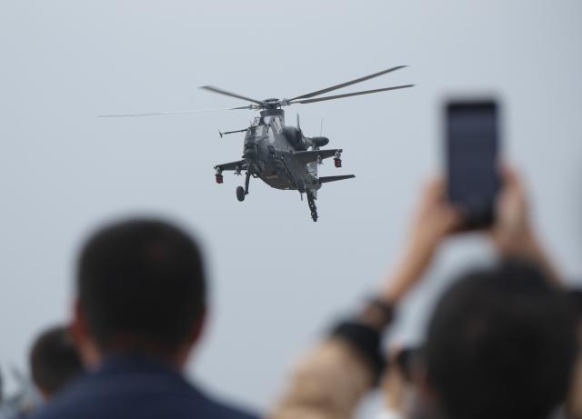 (251016) -- TIANJIN, Oct. 16, 2025 (Xinhua) -- A helicopter of Fenglei aerobatic team of the Chinese People's Liberation Army (PLA) performs during the opening ceremony of the 7th China Helicopter Exposition in north China's Tianjin Municipality, Oct. 16, 2025. Spanning an exhibition area of approximately 160,000 square meters, the exposition kicked off here on Thursday and will last until Oct. 19. (Xinhua/Li Jie)