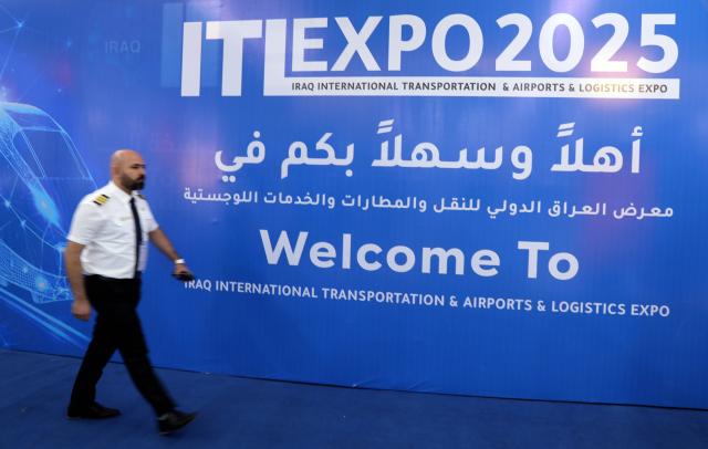 (251016) -- BAGHDAD, Oct. 16, 2025 (Xinhua) -- A man visits the Iraq International Transportation, Airports, and Logistics Expo, in Baghdad, Iraq, Oct. 16, 2025. The Iraq International Transportation, Airports, and Logistics Expo is held in Iraq's capital Baghdad from Oct. 15 to 18. (Xinhua/Khalil Dawood)