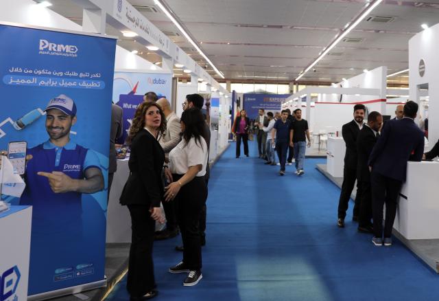 (251016) -- BAGHDAD, Oct. 16, 2025 (Xinhua) -- People visit the Iraq International Transportation, Airports, and Logistics Expo, in Baghdad, Iraq, Oct. 16, 2025. The Iraq International Transportation, Airports, and Logistics Expo is held in Iraq's capital Baghdad from Oct. 15 to 18. (Xinhua/Khalil Dawood)