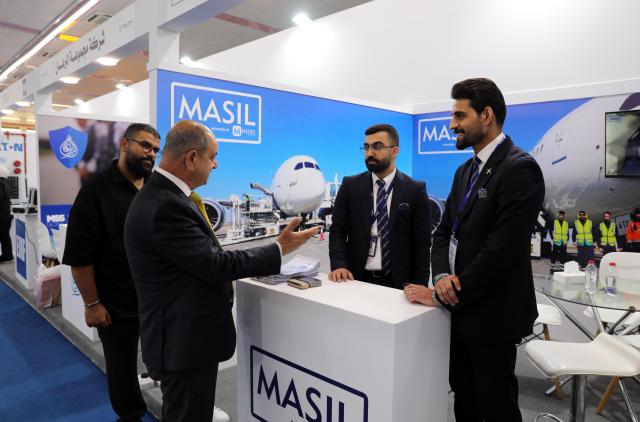 (251016) -- BAGHDAD, Oct. 16, 2025 (Xinhua) -- People visit the Iraq International Transportation, Airports, and Logistics Expo, in Baghdad, Iraq, Oct. 16, 2025. The Iraq International Transportation, Airports, and Logistics Expo is held in Iraq's capital Baghdad from Oct. 15 to 18. (Xinhua/Khalil Dawood)