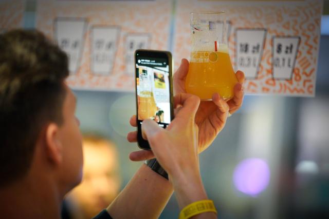 (251016) -- WARSAW, Oct. 16, 2025 (Xinhua) -- A man takes photo of a glass of beer at the 20th Warsaw Beer Festival in Warsaw, Poland, on Oct. 16, 2025. (Photo by Jaap Arriens/Xinhua)
