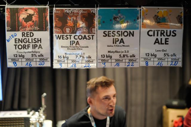 (251016) -- WARSAW, Oct. 16, 2025 (Xinhua) -- A brewer makes introduction of beer varieties at the Warsaw Beer Festival in Warsaw, Poland, on Oct. 16, 2025. (Photo by Jaap Arriens/Xinhua)