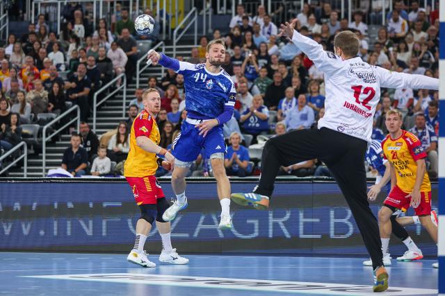 (251017) -- ZAGREB, Oct. 17, 2025 (Xinhua) -- Ihar Bialiauski (2nd L) of HC Zagreb shoots the ball during the EHF Champions League group B Round 5 match between HC Zagreb and GOG in Zagreb, Croatia, Oct. 16, 2025. (Photo by Goran Stanzl/PIXSELL via Xinhua)