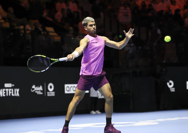 (251017) -- RIYADH, Oct. 17, 2025 (Xinhua) -- Carlos Alcaraz of Spain hits a return during the semifinal match against Taylor Fritz of the United States at the Six Kings Slam tennis tournament in Riyadh, Saudi Arabia, Oct. 16, 2025. (Xinhua/Luo Chen)