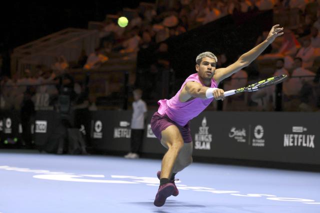 (251017) -- RIYADH, Oct. 17, 2025 (Xinhua) -- Carlos Alcaraz of Spain hits a return during the semifinal match against Taylor Fritz of the United States at the Six Kings Slam tennis tournament in Riyadh, Saudi Arabia, Oct. 16, 2025. (Xinhua/Luo Chen)