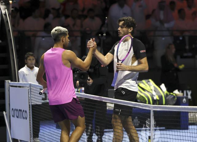 (251017) -- RIYADH, Oct. 17, 2025 (Xinhua) -- Carlos Alcaraz (L) of Spain and Taylor Fritz of the United States shake hands after their semifinal match at the Six Kings Slam tennis tournament in Riyadh, Saudi Arabia, Oct. 16, 2025. (Xinhua/Luo Chen)
