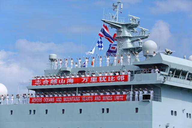 (251017) -- SATTAHIP, Oct. 17, 2025 (Xinhua) -- The crew of Chinese People's Liberation Army (PLA) Navy ship Qi Jiguang wave to the crowds in Sattahip naval base in eastern Thailand's Chonburi province, Oct. 16, 2025. The Chinese PLA Navy's 83rd taskforce arrived in Sattahip naval base in eastern Thailand's Chonburi province on Thursday, starting a four-day goodwill visit to the country. (Xinhua/Sun Weitong)