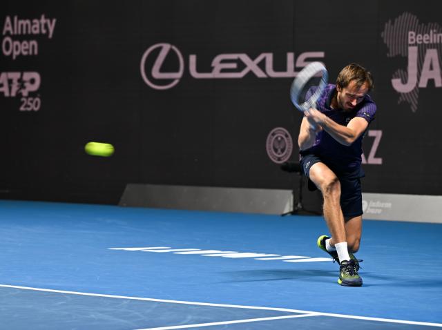 (251017) -- ALMATY, Oct. 17, 2025 (Xinhua) -- Daniil Medvedev of Russia hits a return during the men's singles quarterfinal match against Fabian Marozsan of Hungary at the ATP250 Almaty Tennis Open in Almaty, Kazakhstan, on Oct. 17, 2025. (Xinhua/Li Renzi)