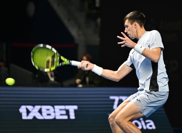 (251017) -- ALMATY, Oct. 17, 2025 (Xinhua) -- Fabian Marozsan of Hungary hits a return during the men's singles quarterfinal match against Daniil Medvedev of Russia at the ATP250 Almaty Tennis Open in Almaty, Kazakhstan, on Oct. 17, 2025. (Xinhua/Li Renzi)