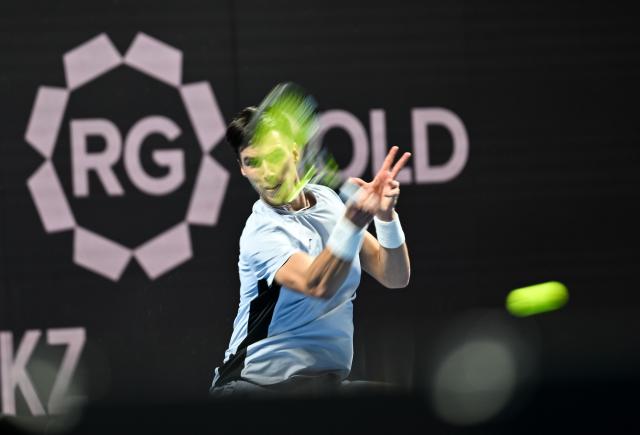(251017) -- ALMATY, Oct. 17, 2025 (Xinhua) -- Fabian Marozsan of Hungary hits a return during the men's singles quarterfinal match against Daniil Medvedev of Russia at the ATP250 Almaty Tennis Open in Almaty, Kazakhstan, on Oct. 17, 2025. (Xinhua/Li Renzi)