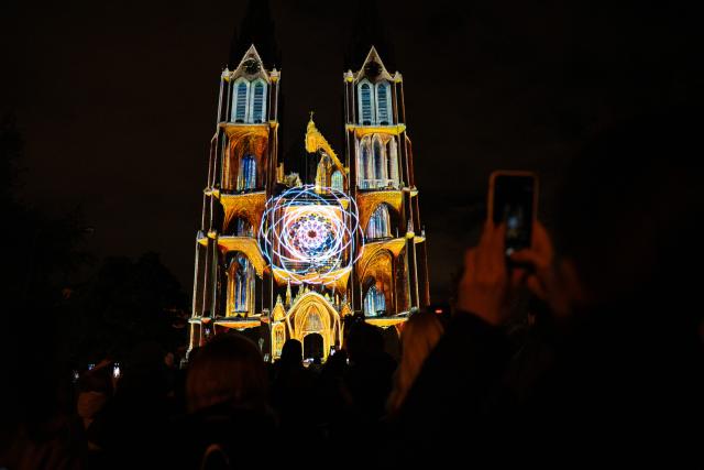 (251017) -- PRAGUE, Oct. 17, 2025 (Xinhua) -- An architecture is illuminated during the Signal Festival in Prague, the Czech Republic, Oct. 17, 2025. The streets and historic landmarks of Prague have once again come alive with light and digital art as the 13th edition of the Signal Festival opened on Thursday evening. (Photo by Dana Kesnerova/Xinhua)