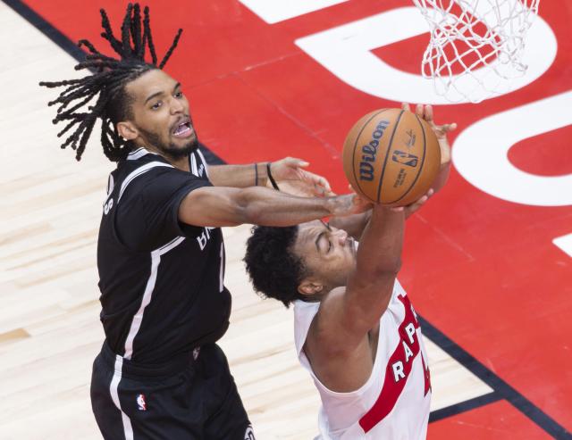 (251018) -- TORONTO, Oct. 18, 2025 (Xinhua) -- Ziaire Williams (L) of Brooklyn Nets vies with Scottie Barnes of Toronto Raptors during the 2025-2026 NBA preseason game between Toronto Raptors and Brooklyn Nets in Toronto, Canada, on Oct. 17, 2025. (Photo by Zou Zheng/Xinhua)