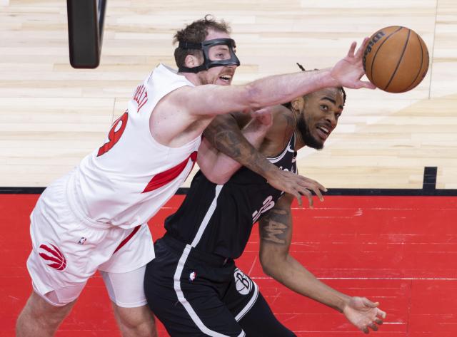 (251018) -- TORONTO, Oct. 18, 2025 (Xinhua) -- Jakob Poeltl (L) of Toronto Raptors vies with Nic Claxton of Brooklyn Nets during the 2025-2026 NBA preseason game between Toronto Raptors and Brooklyn Nets in Toronto, Canada, on Oct. 17, 2025. (Photo by Zou Zheng/Xinhua)