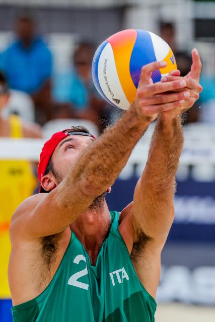 (251018) -- LAGUNA PROVINCE, Oct. 18, 2025 (Xinhua) -- Alex Ranghieri of Italy competes during the men's quarterfinal match between Manuel Alfieri/Alex Ranghieri of Italy and Bintang Akbar/Sofyan Rachman Efendi of Indonesia at the Volleyball World Beach Pro Tour in Laguna Province, the Philippines, Oct. 18, 2025. (Xinhua/Rouelle Umali)