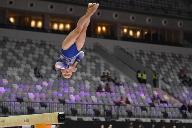 (251018) -- JAKARTA, Oct. 18, 2025 (Xinhua) -- Zhou Yaqin of China practices on the balance beam as preparation of the 53rd FIG Artistic Gymnastics World Championships in Jakarta, Indonesia, Oct. 18, 2025. The 53rd FIG Artistic Gymnastics World Championships are being held in Jakarta, Indonesia, from Oct. 19 to Oct. 25, 2025. (Xinhua/Agung Kuncahya B.)