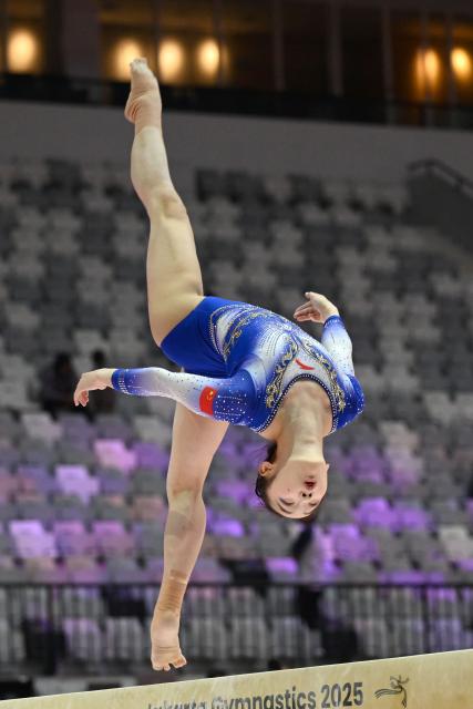 (251018) -- JAKARTA, Oct. 18, 2025 (Xinhua) -- Zhou Yaqin of China practices on the balance beam as preparation of the 53rd FIG Artistic Gymnastics World Championships in Jakarta, Indonesia, Oct. 18, 2025. The 53rd FIG Artistic Gymnastics World Championships are being held in Jakarta, Indonesia, from Oct. 19 to Oct. 25, 2025. (Xinhua/Agung Kuncahya B.)
