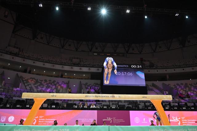 (251018) -- JAKARTA, Oct. 18, 2025 (Xinhua) -- Zhang Qingying of China practices on the balance beam as preparation of the 53rd FIG Artistic Gymnastics World Championships in Jakarta, Indonesia, Oct. 18, 2025. The 53rd FIG Artistic Gymnastics World Championships are being held in Jakarta, Indonesia, from Oct. 19 to Oct. 25, 2025. (Xinhua/Agung Kuncahya B.)