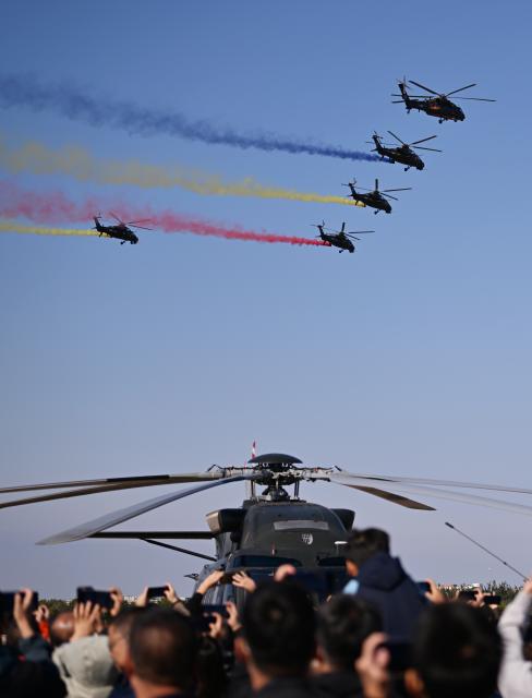 (251018) -- TIANJIN, Oct. 18, 2025 (Xinhua) -- Helicopters of the Fenglei aerobatic team of the Chinese People's Liberation Army (PLA) perform during the 7th China Helicopter Exposition in north China's Tianjin Municipality, Oct. 18, 2025. The exposition opened to the general public on Saturday. (Xinhua/Li Ran)