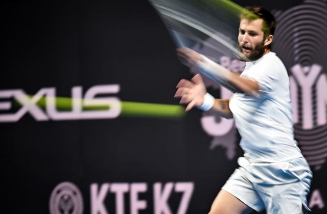 (251019) -- ALMATY, Oct. 19, 2025 (Xinhua) -- Corentin Moutet of France hits a return during the men's singles semifinal match against Alex Michelsen of the United States at the ATP 250 Almaty Tennis Open in Almaty, Kazakhstan, on Oct. 18, 2025. (Xinhua/Li Renzi)