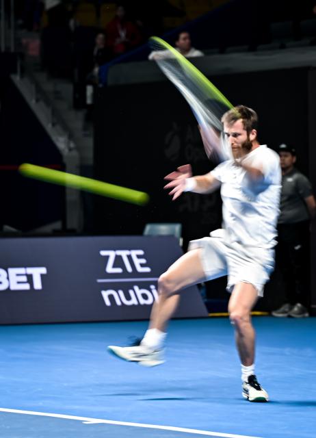 (251019) -- ALMATY, Oct. 19, 2025 (Xinhua) -- Corentin Moutet of France hits a return during the men's singles semifinal match against Alex Michelsen of the United States at the ATP 250 Almaty Tennis Open in Almaty, Kazakhstan, on Oct. 18, 2025. (Xinhua/Li Renzi)