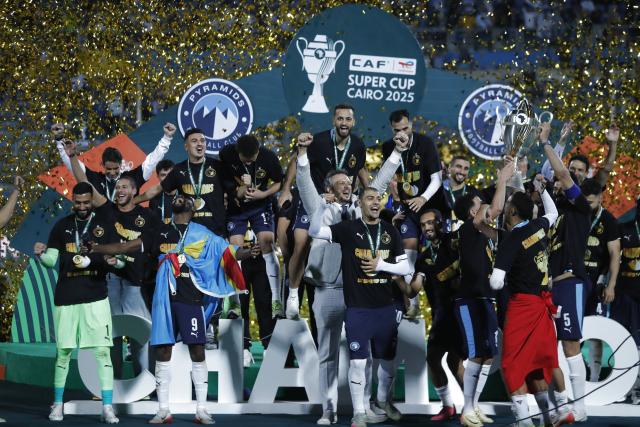 (251019) -- CAIRO, Oct. 19, 2025 (Xinhua) -- Members of Pyramids FC celebrate at the awarding ceremony after winning the CAF (Confederation of African Football) Super Cup 2025 final match between Pyramids FC of Egypt and RS Berkane of Morocco in Cairo, Egypt, on Oct. 18, 2025. (Xinhua/Ahmed Gomaa)