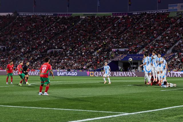 (251020) -- SANTIAGO, Oct. 20, 2025 (Xinhua) -- Yassir Zabiri (2nd L) of Morocco scores a goal during the final match between Argentina and Morocco at the FIFA U-20 World Cup Chile 2025 in Santiago, Chile, Oct. 19, 2025. (Xinhua/Meng Dingbo)