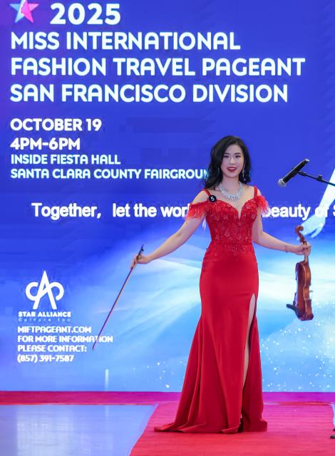 (251020) -- SAN FRANCISCO, Oct. 20, 2025 (Xinhua) -- A competitor participates in the final of San Francisco Division of 2025 Miss International Fashion Travel Pageant in San Jose of San Francisco Bay Area, the United States, Oct. 19, 2025. (Photo by Dong Xudong/Xinhua)