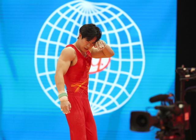 (251020) -- JAKARTA, Oct. 20, 2025 (Xinhua) -- Zhang Boheng of China reacts after the Men's Horizontal Bar Qualification at the 53rd FIG Artistic Gymnastics World Championships in Jakarta, Indonesia, on Oct. 20, 2025. (Xinhua/Cen Yunpeng)