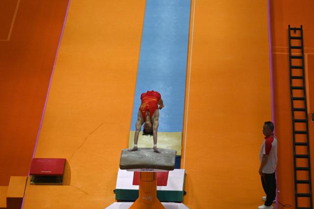 (251020) -- JAKARTA, Oct. 20, 2025 (Xinhua) -- Huang Mingqi of China practices before the Men's Vault Qualification at the 53rd FIG Artistic Gymnastics World Championships in Jakarta, Indonesia, on Oct. 20, 2025. (Xinhua/Agung Kuncahya B.)