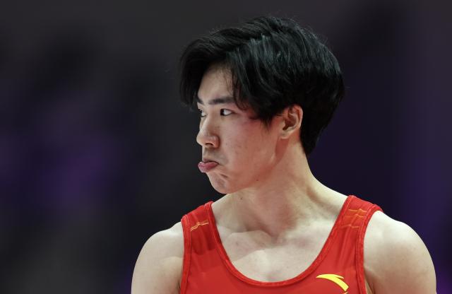 (251020) -- JAKARTA, Oct. 20, 2025 (Xinhua) -- Zhang Boheng of China reacts after the Men's Floor Exercise Qualification at the 53rd FIG Artistic Gymnastics World Championships in Jakarta, Indonesia, on Oct. 20, 2025. (Xinhua/Bai Xuefei)