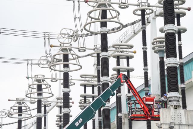 (251020) -- XUANCHENG, Oct. 20, 2025 (Xinhua) -- Staff members conduct maintenance work at the Guquan converter station in Xuncheng, east China's Anhui Province, Oct. 20, 2025. The Guquan converter station on the Changji-Guquan ultra-high voltage direct current (UHVDC) transmission line that transmits electricity from Xinjiang to east China is undergoing a 7-day annual overhaul started from Oct. 17.
   The Changji-Guquan transmission line, which was put into operation in September 2019, leads the world in terms of voltage level, transmission capacity and distance. (Xinhua/Du Yu)