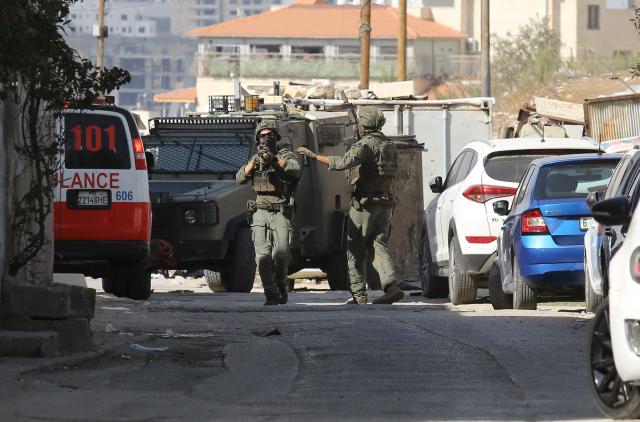 (251020) -- NABLUS, Oct. 20, 2025 (Xinhua) -- Israeli soldiers are seen during a military raid in the West Bank city of Nablus, on Oct. 19, 2025. A Palestinian man was killed by the Israeli army in Nablus, the Palestinian Health Ministry reported on Sunday. (Photo by Nidal Eshtayeh/Xinhua)