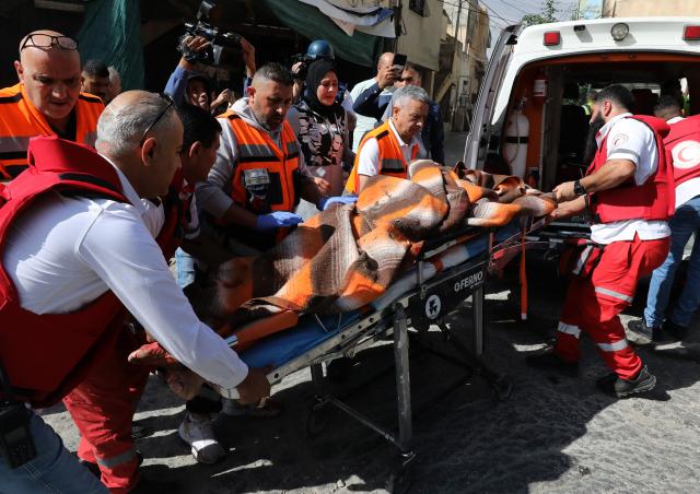 (251020) -- NABLUS, Oct. 20, 2025 (Xinhua) -- Medics are seen evacuating a Palestinian man who was killed by the Israeli army in the West Bank city of Nablus, on Oct. 19, 2025. A Palestinian man was killed by the Israeli army in Nablus, the Palestinian Health Ministry reported on Sunday. (Photo by Nidal Eshtayeh/Xinhua)