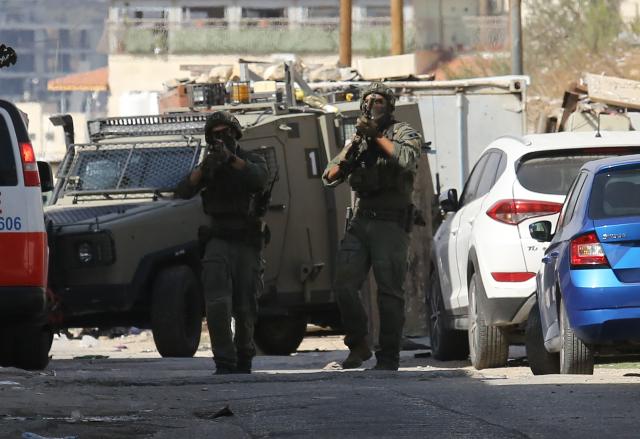 (251020) -- NABLUS, Oct. 20, 2025 (Xinhua) -- Israeli soldiers are seen during a military raid in the West Bank city of Nablus, on Oct. 19, 2025. A Palestinian man was killed by the Israeli army in Nablus, the Palestinian Health Ministry reported on Sunday. (Photo by Nidal Eshtayeh/Xinhua)