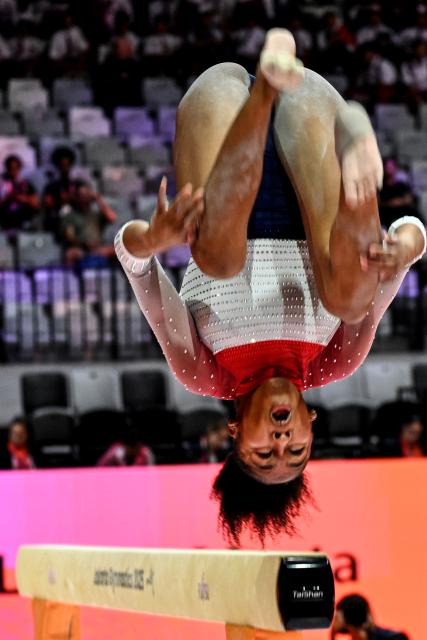 (251021) -- JAKARTA, Oct. 21, 2025 (Xinhua) -- Skye Blakely of the United States competes on the Women's Balance Beam Qualification at the 53rd FIG World Artistic Gymnastics Championships at Indonesia Arena Stadium in Jakarta, Indonesia, Oct. 21, 2025. (Xinhua/Agung Kuncahya B.)