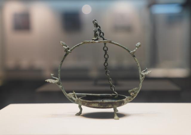 (251021) -- HEPU, Oct. 21, 2025 (Xinhua) -- This photo taken on Oct. 21, 2025 shows an exhibit at the Han-cultural Museum in Hepu County, south China's Guangxi Zhuang Autonomous Region. The Han-cultural Museum of Hepu County, established in 1978, focuses on the historical and cultural display of the Maritime Silk Road during the Han Dynasty (202 B.C.-220 A.D.). The museum covers an area of 13,300 square meters, and houses a total of 5,208 pieces and sets of cultural relics. (Xinhua/Zhou Jiayi)