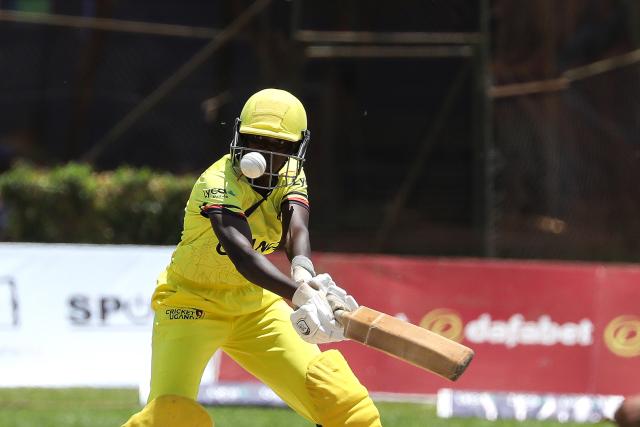 (251022) -- KAMPALA, Oct. 22, 2025 (Xinhua) -- Esther Iloku of Uganda competes during the Day Two 2025 Victoria Series campaign cricket match between Uganda and Canada at the Lugogo Cricket Oval in Kampala, on Oct. 21, 2025. (Photo by Hajarah Nalwadda/Xinhua)