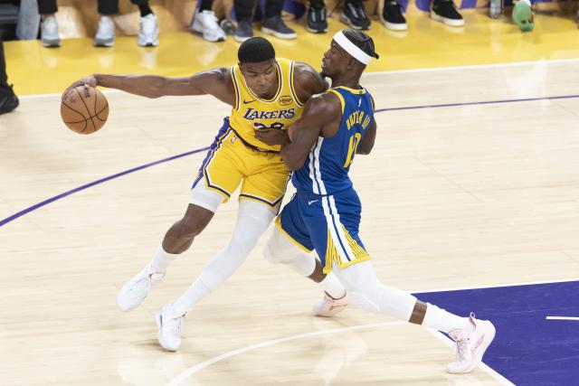 (251022) -- LOS ANGELES, Oct. 22, 2025 (Xinhua) -- Los Angeles Lakers' Rui Hachimura (L) drives against Golden State Warriors' Jimmy Butler III during the 2025-2026 NBA regular season match between Los Angeles Lakers and Golden State Warriors in Los Angeles, the United States, Oct. 21, 2025. (Photo by Ringo Chiu/Xinhua)