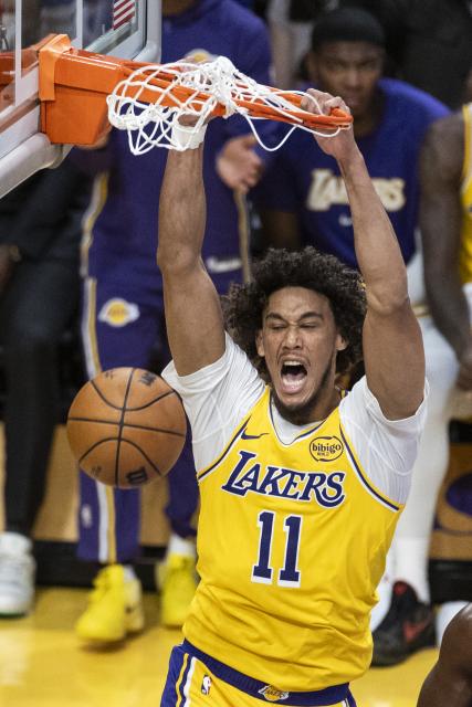 (251022) -- LOS ANGELES, Oct. 22, 2025 (Xinhua) -- Los Angeles Lakers' Jaxson Hayes dunks during the 2025-2026 NBA regular season match between Los Angeles Lakers and Golden State Warriors in Los Angeles, the United States, Oct. 21, 2025. (Photo by Ringo Chiu/Xinhua)