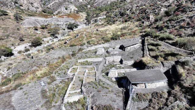 (251022) -- YINCHUAN, Oct. 22, 2025 (Xinhua) -- An aerial drone photo taken on Oct. 13, 2025 shows an excavation area of the remnants of the Suyukou kiln in Helan Mountain in Yinchuan, capital of northwest China's Ningxia Hui Autonomous Region. Remnants of the Suyukou kiln were discovered in 2017 in Yinchuan, capital of Ningxia, and cover an area of roughly 40,000 square meters.
   From 2021 to 2025, archaeologists from the Ningxia Institute of Cultural Relics and Archaeology and Fudan University found remnants of workshops featuring eight furnaces, as well as pits where workers used to mine porcelain clay, coal, quartz, lime and other raw materials and fuels, which were needed to make porcelain. 
   The Suyukou site is believed to be the earliest Western Xia Dynasty kiln site found to date in China. Judging from its production scale and saggars marked with the character guan, which literally means official, archaeologists believe that the Suyukou kiln was an official kiln producing bowls, cups, plates and other daily utensils -- mainly for the royal family during the Western Xia Dynasty (1038-1227). (Xinhua/Wang Peng)