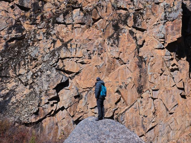 (251022) -- CHENGDU, Oct. 22, 2025 (Xinhua) -- Chen Xuesong, a cultural heritage conservator, checks rock paintings in Garze Tibetan Autonomous Prefecture, southwest China's Sichuan Province, Oct. 21, 2025. This group of rock paintings in the prefecture dates back about 8,000 years. (Xinhua/Xue Chen)