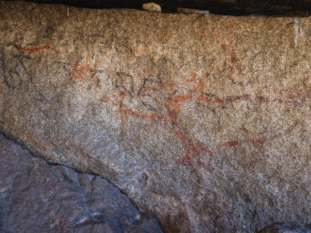 (251022) -- CHENGDU, Oct. 22, 2025 (Xinhua) -- This photo taken on Oct. 21, 2025 shows rock paintings that feature deer-shaped images in Garze Tibetan Autonomous Prefecture, southwest China's Sichuan Province. This group of rock paintings in the prefecture dates back about 8,000 years. (Xinhua/Xue Chen)