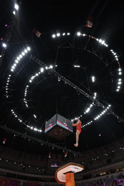 (251022) -- JAKARTA, Oct. 22, 2025 (Xinhua) -- Zhang Boheng of China competes during the Vault of Men's All-Round Final at the 53rd FIG Artistic Gymnastics World Championships in Jakarta, Indonesia, on Oct. 22, 2025. (Xinhua/Bai Xuefei)
