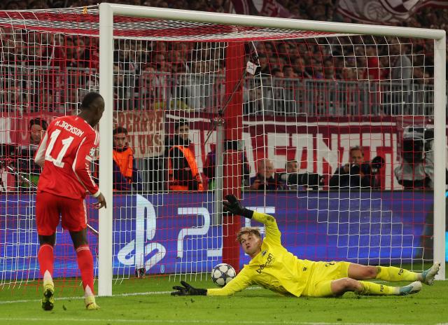(251023) -- MUNICH, Oct. 23, 2025 (Xinhua) -- Nicolas Jackson (L) of Bayern Munich shoots to score during the UEFA Champions League football match between Bayern Munich and Club Brugge in Munich, Germany, Oct. 22, 2025. (Photo by Philippe Ruiz/Xinhua)