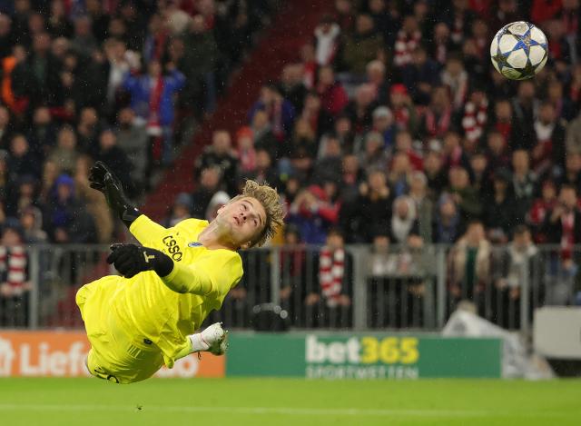 (251023) -- MUNICH, Oct. 23, 2025 (Xinhua) -- Nordin Jackers goalkeeper of Club Brugge makes a save during the UEFA Champions League football match between Bayern Munich and Club Brugge in Munich, Germany, Oct. 22, 2025. (Photo by Philippe Ruiz/Xinhua)
