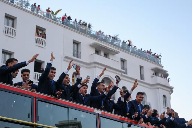 (251023) -- RABAT, Oct. 23, 2025 (Xinhua) -- Players of Morocco U20 football team celebrate during a parade celebrating them winning the U20 World Cup in Rabat, Morocco, Oct. 22, 2025. (Xinhua/Huo Jing)