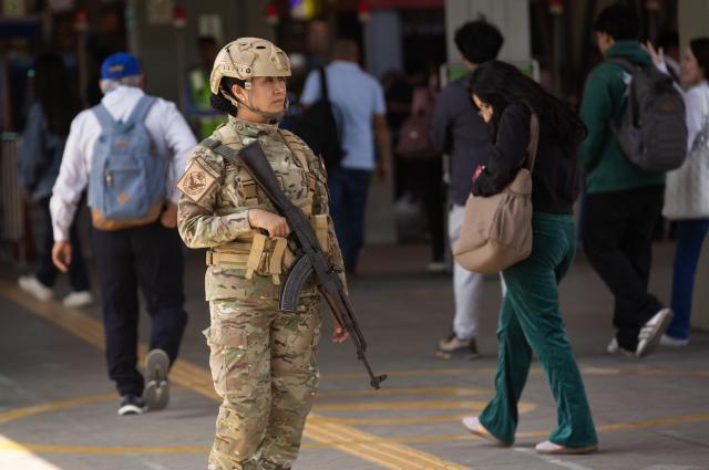 (251023) -- LIMA, Oct. 23, 2025 (Xinhua) -- A service woman patrols the La Cultura metro station in Lima, Peru, on Oct. 22, 2025. Peruvian President Jose Jeri declared on Tuesday a 30-day state of emergency for the capital Lima and the neighboring Callao region to tackle worsening public security. (Xinhua/Mariana Bazo)