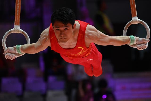 (251023) -- JAKARTA, Oct. 23, 2025 (Xinhua) -- Shi Cong of China competes on the rings during the Men's All-Around Final of the 53rd FIG World Artistic Gymnastics Championships at Indonesia Arena Stadium in Jakarta, Indonesia, Oct. 22, 2025. (Xinhua/Agung Kuncahya B.)