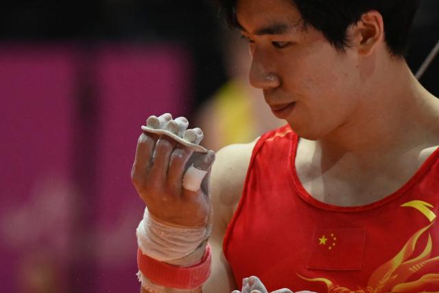 (251023) -- JAKARTA, Oct. 23, 2025 (Xinhua) -- Zhang Boheng reacts during the Men's All-Around Final of the 53rd FIG World Artistic Gymnastics Championships at Indonesia Arena Stadium in Jakarta, Indonesia, Oct. 22, 2025. (Xinhua/Agung Kuncahya B.)